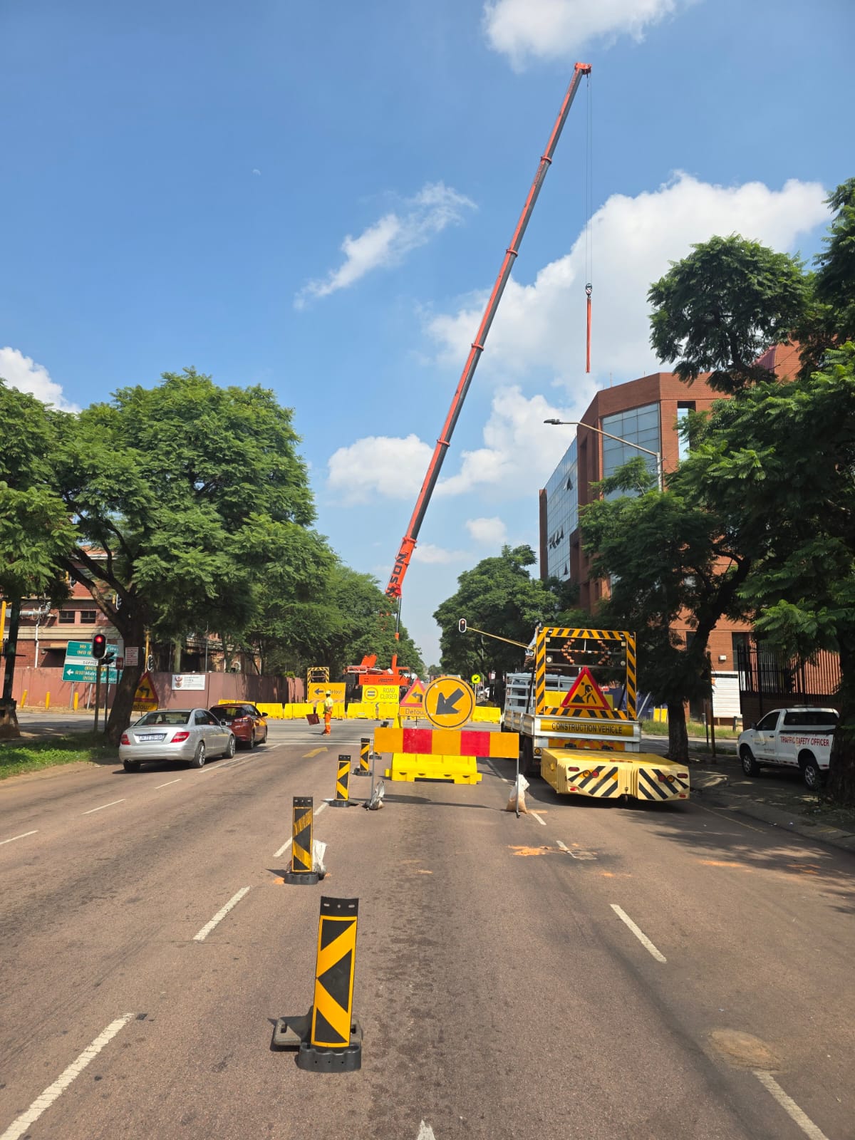 Road closure and crane lift managed on a city street